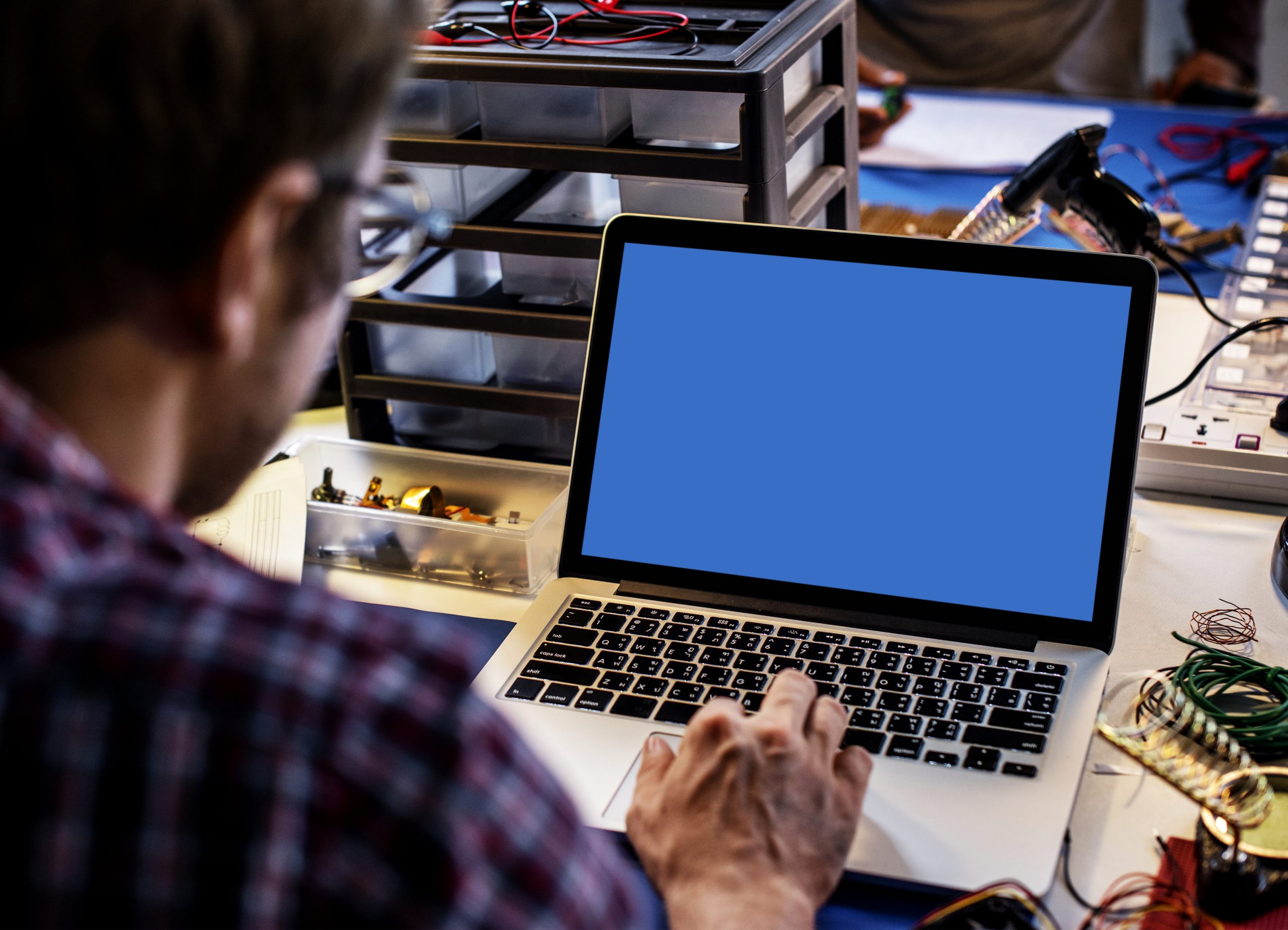 Computer laptop showing blank blue screen