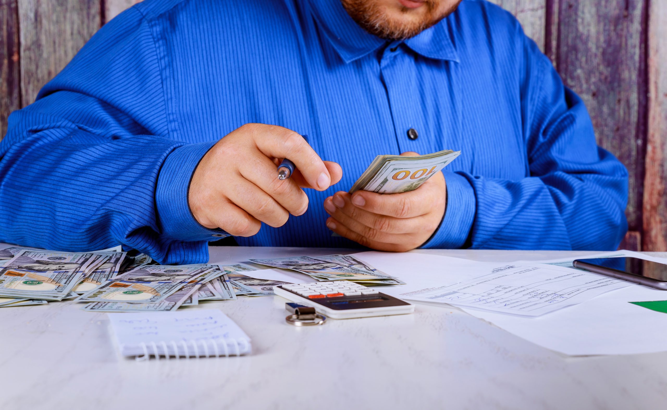 Businessman hand recount dollars. the man counts the money new hundred-dollar bills